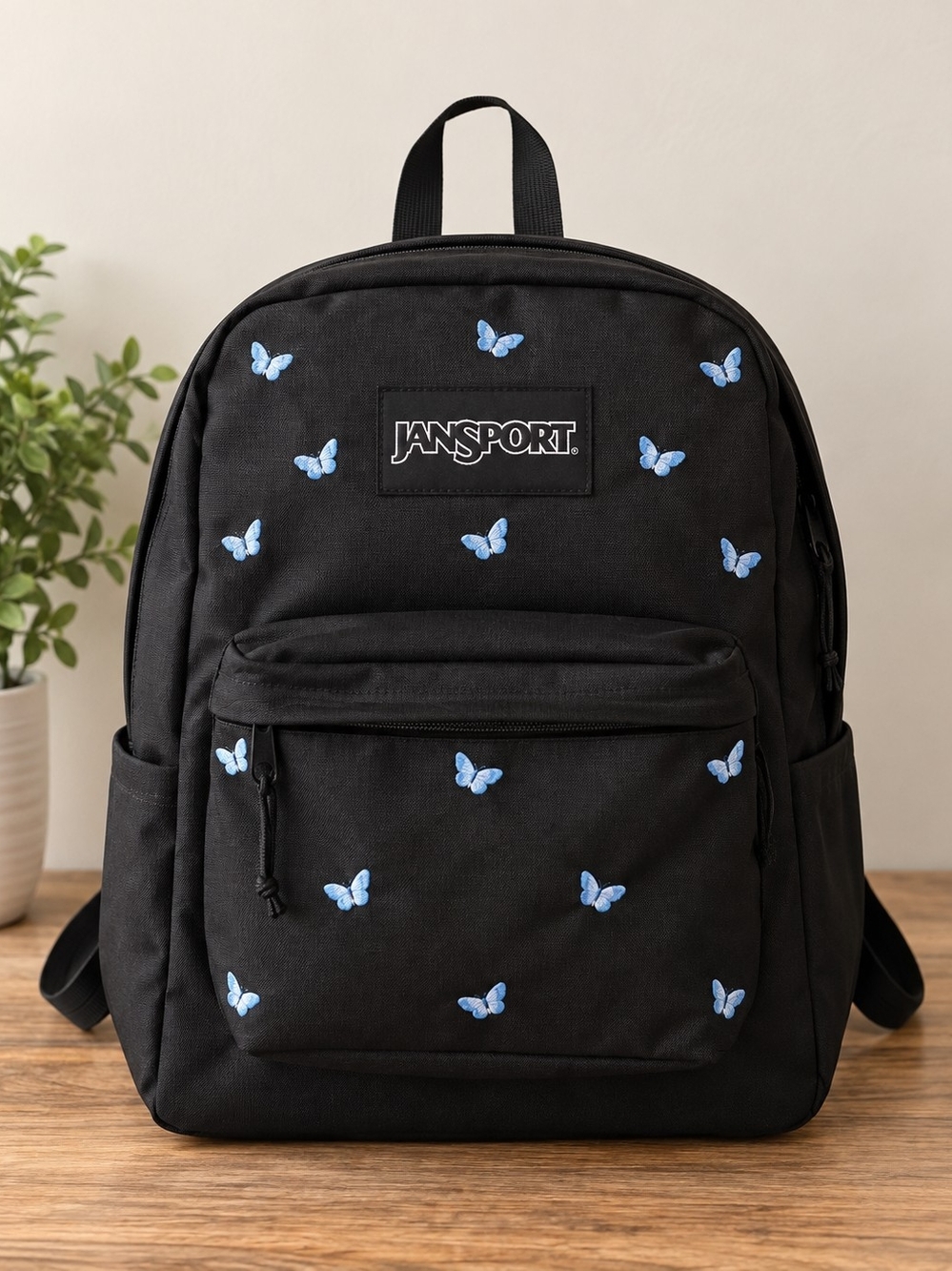 Jansport Black Backpack with Light Blue Butterfly Embroidery